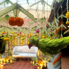 It's the small, handcrafted details that bring a traditional theme to life. For this event, I included these charming parrots made from leaves, adding a touch of nature and artistry to the South Indian decor.