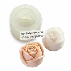 This image displays a rosebud mold along with two finished products in different colors. It shows the versatility of a single mold in creating varied and beautiful soaps or candles.