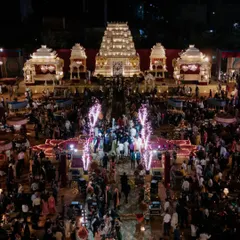 An aerial view showcasing the epic scale of our Mysore Mandira wedding, designed for over 4,000 guests. The layout featured a 200-foot aisle, seamlessly integrated dining and lounge areas, and a sacred path symbolizing the couple's divine union.