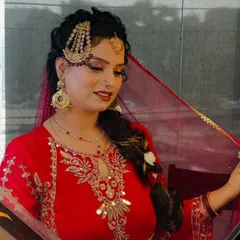 A side profile showcasing the elaborate hair jewelry (passa) and the detailed braid. This highlights my team's skill in traditional hairstyling, which is essential for completing the bridal look.