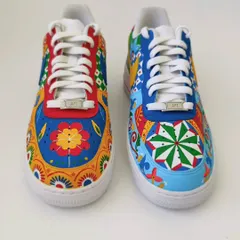 This is a mismatched pair of Nike Air Force 1s I created for a client who wanted something truly outlandish. I combined different Indian folk art patterns and colours on each shoe, creating a maximalist design that is full of energy and personality.