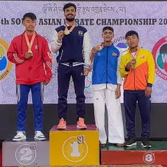 Tushar stands at the top of the podium, having won gold at the South Asian Karate Championship. This is the level of excellence we strive for in every competition.