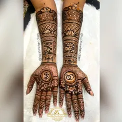 A classic engagement mehndi design. I incorporated the couple's initials and interlocking rings into a beautiful floral pattern, making it a perfect symbol of their union.