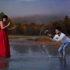 A fun and playful moment from a pre-wedding shoot at a lake. I encourage couples to interact naturally, allowing me to capture genuine moments of joy and connection like this water splash.