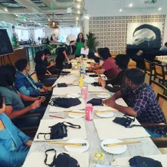 Here I am kicking off a tote bag painting workshop for a private group. I start by explaining the process and sharing tips to help everyone feel comfortable and ready to create.