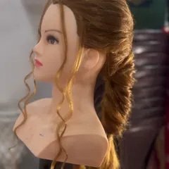 A modern, textured ponytail with soft curls. This versatile hairstyle is perfect for receptions or parties, and we cover how to create volume and texture in my course.