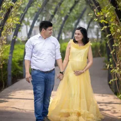 A simple walk along a tree-lined, arched pathway in the park makes for a beautiful and romantic couple's portrait.