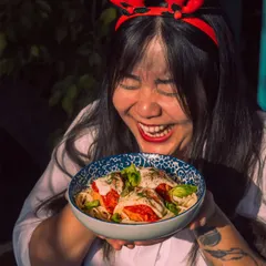 Pure joy and festive flavors. A guest delights in a dish from our Christmas menu, capturing the happy and indulgent spirit of the season at Roxie.