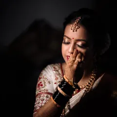 An emotional and artistic portrait of the bride. The use of shadow and light creates a powerful, moody image that tells a story.