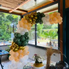 This side angle shows the depth and structure of the organic balloon arch. I build these to fit perfectly within your space, whether it's framing a doorway or a corner table.