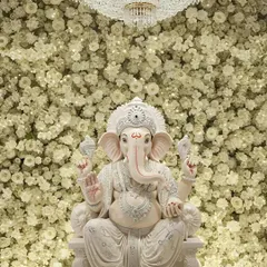 Welcoming Bappa with purity and elegance. This Ganpati decoration features a dense wall of fresh white flowers, creating a serene and divine atmosphere for the festival.
