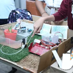 This project is an automated plant watering system, designed and built by a student in our Pro-Innovator category. It uses sensors to detect soil moisture and water the plant automatically, a great example of solving a real-world problem with robotics.