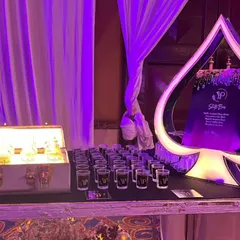 For a casino-themed night, we designed this custom Ace of Spades shot bar. It's an example of how we build unique, immersive experiences around your event's theme, complete with glowing displays and signature shots.
