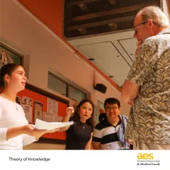 A student explains her TOK project to a teacher. This core IB component challenges students to reflect on the nature of knowledge and how we know what we claim to know.