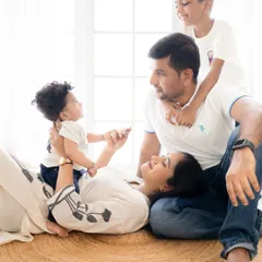 A candid moment from a beautiful family photoshoot in Bangalore. It's these unposed, playful interactions that truly capture the love and connection you share.