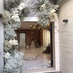 A dreamy and ethereal entranceway. We used dried and preserved baby's breath and branches to create a rustic, winter-wonderland feel for this modern home.