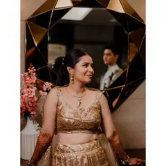 An artistic portrait using a mirror to reflect the groom while the bride is in the foreground. This creative composition adds a layer of intrigue and romance to the image.