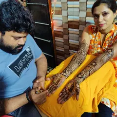 Here I am with a client showcasing her completed full bridal design. It is a proud moment to see the skills learned in my Kandivali studio being put into practice to create such beautiful, professional-level work.