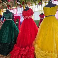 A colorful display of some of our ball gowns on rent. We have a wide variety of colors like green, red, and yellow, perfect for any theme or occasion.