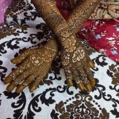 The beautiful, dark stain of a completed bridal hand design. The intricate patterns are clear and sharp, showcasing the quality of the organic henna.