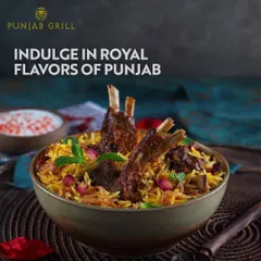 Indulge in the royal flavours of Punjab with this magnificent lamb biryani from Punjab Grill. The dish, garnished with mint and rose petals, represents the rich and aromatic offerings of North Indian cuisine.