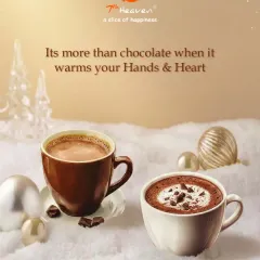 When you need a warm hug in a mug, our hot chocolate is the answer. This image showcases two of our popular styles: a classic smooth hot chocolate and a richer version topped with whipped cream and chocolate shavings, perfect for a cozy winter day.