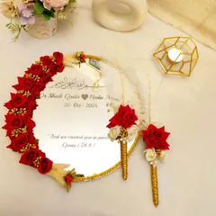 For your most sacred "Qubool Hai" moment. I designed this personalized 'Muah Dekhaye' mirror with deep red roses and delicate feathers. The couple's names and wedding date are inscribed, along with a verse from the Quran, making it a cherished keepsake of your Nikah.