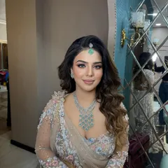 Another angle of this beautiful soft glam look. The skin looks luminous from every angle, and the makeup perfectly complements her pastel outfit and diamond jewelry.