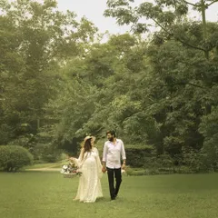 Walking hand-in-hand through nature, this shot captures the feeling of starting a new journey together.