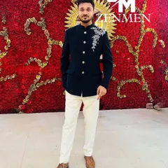 A client looking sharp in my embroidered blue velvet Jodhpuri suit. Paired with white trousers, it's a perfect look for a wedding reception or sangeet.