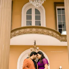 A regal setting for a royal love story. This shot at a palatial location in Bangalore uses grand architecture and a stunning chandelier to frame the couple's intimate moment.