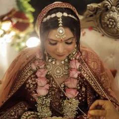 This candid shot during the jaimala ceremony shows the bride's glowing, natural-looking skin. I use techniques that ensure the makeup looks fresh and not heavy, even up close.