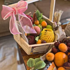 For a Roka trousseau, I went with a Moroccan-inspired evil eye theme. This fruit basket is just one part of a larger collection where every detail, from burlap wraps to fairy lights, tied the whole look together.