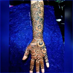 This image shows the full detail of a design on the back of the hand and arm. You can clearly see the delicate floral and paisley elements.
