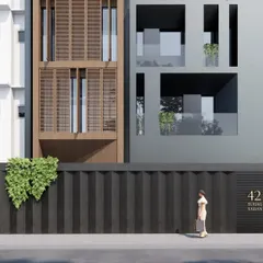 This rendering highlights the entrance and ground level of 'Project 42'. The design focuses on creating a secure and welcoming entry, with materials and lighting chosen to complement the modern aesthetic of the overall structure.
