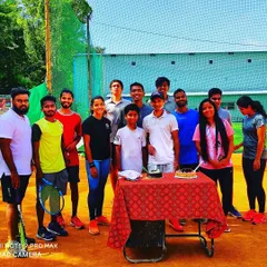 We are more than just a team, we are a family. Here is our group celebrating a birthday together on the court after a training session.