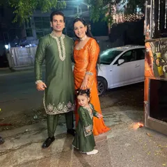 We love dressing the entire family for festive occasions. Here is a beautiful family coordinated for Diwali in rich green and orange ethnic wear. The custom kurta sets feature intricate leather embroidery, designed to create a cohesive and elegant look for your family portraits.