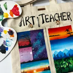 A detailed shot of my custom "Art Teacher" tote bag. I used fabric-safe acrylics to paint various miniature landscapes on the pockets, creating a bag that is both a tool and a showcase of art.