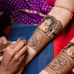 A detailed forearm design featuring a beautifully rendered portrait of Lord Ganesha. This type of spiritual mehendi is perfect for invoking blessings during auspicious occasions like weddings and festivals.