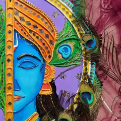 A close up of my Krishna Lippan art, showing the detailed 3D clay and mirror work. This piece combines the traditional art form of Kutch with a divine depiction of Lord Krishna, complete with his peacock feather.