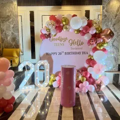 A closer look at the 20th birthday backdrop, showing the custom text and the large marquee numbers.