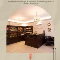 The reception area of the Truefitt & Hill salon sets the tone for the entire experience. We used classic dark wood for the custom reception desk and product display shelves, complemented by elegant chandeliers and a polished floor to create a sophisticated first impression.
