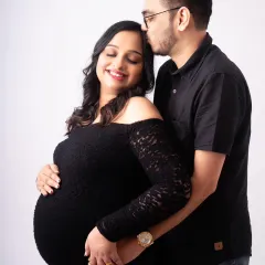 A quiet moment of connection. A gentle kiss on the forehead speaks volumes. I love capturing these unscripted, tender interactions that show the deep love between partners during a maternity shoot.