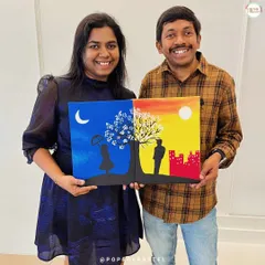 Another happy couple celebrating their anniversary with a creative art date. Their two canvases join to form a single, romantic day-and-night scene.