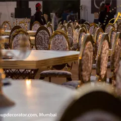 A closer look at the elegant seating arrangement for a grand wedding. The rows of gold and damask chairs create a regal atmosphere for guests, ensuring every detail contributes to the event's luxury.