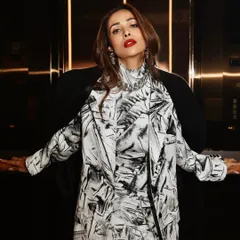 Malaika Arora in an elevator, a moment of high fashion in an everyday space. This editorial shoot was about finding glamour in unexpected places, using the ambient light to create a dramatic and powerful portrait.