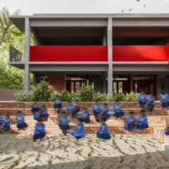 An open-air amphitheater with tiered brick seating serves as a flexible gathering space at the Mandya school. It is designed for everything from school assemblies to community performances, blurring the line between the institution and its rural setting.