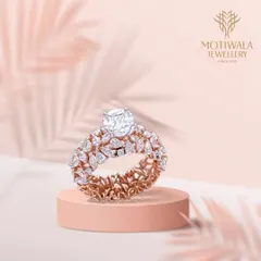 A truly magnificent creation. This ring features a prominent cushion-cut solitaire, elevated above a double band of intricately set marquise-cut diamonds, creating a piece of unparalleled brilliance and design.