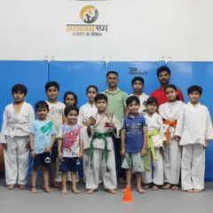Our kids' team celebrating a major win at a karate championship. We teach them the value of hard work, perseverance, and sportsmanship.