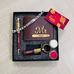 Celebrate Raksha Bandhan with this personalized gift set for your brother. It includes a custom wallet, a crystal-filled pen, a keychain, and a name-engraved bracelet, along with a Rakhi card and traditional roli-chawal.